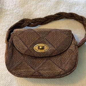 Lovely gold/copper colored handbag.